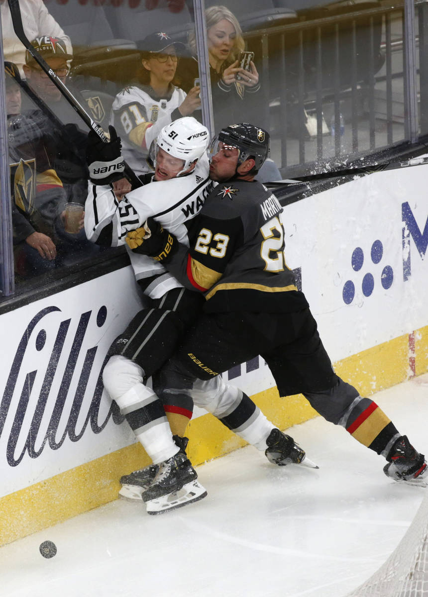Vegas Golden Knights defenseman Alec Martinez (23) and Los Angeles Kings left wing Austin Wagne ...