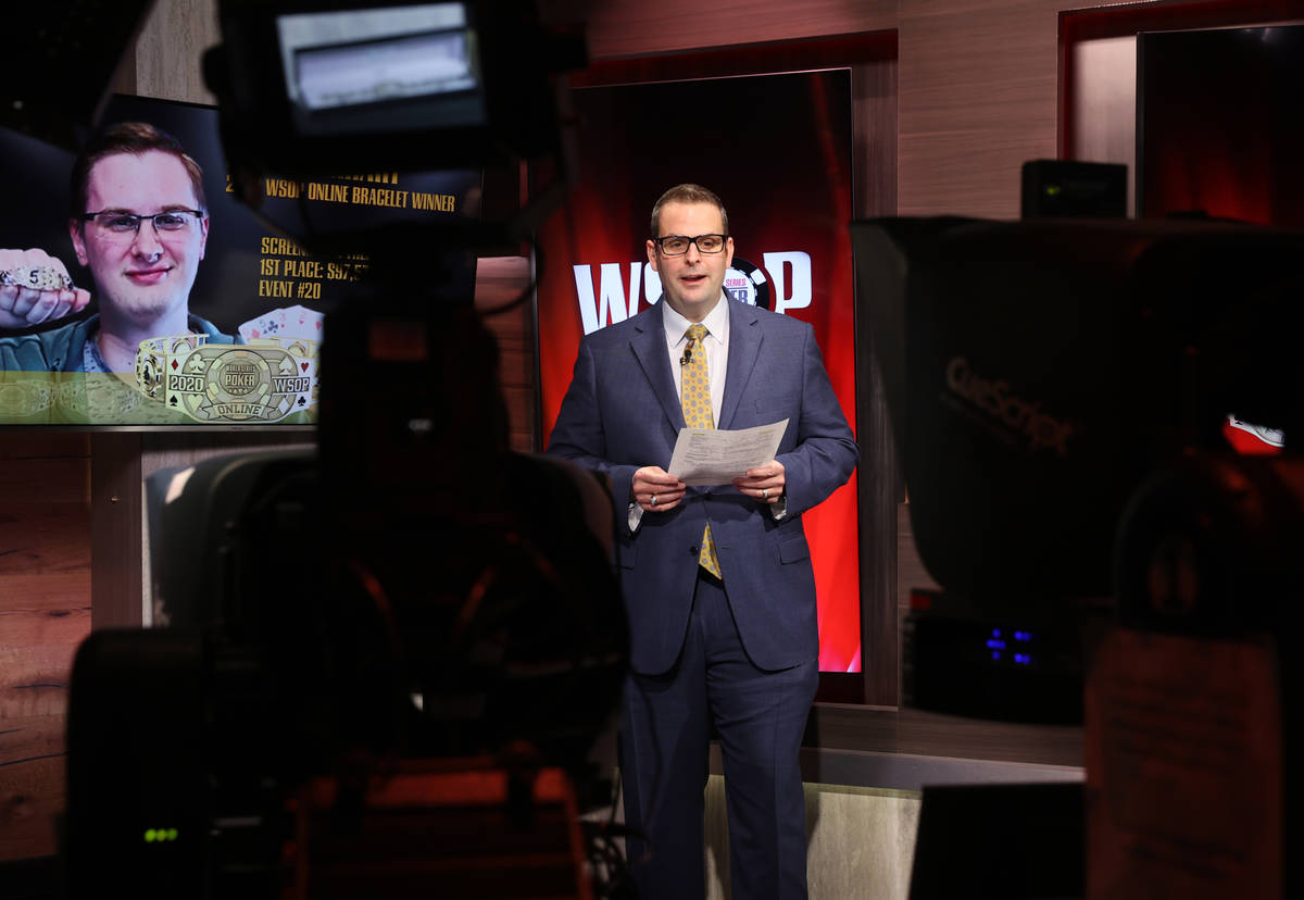 Jack Effel, World Series of Poker vice president, prepares to present Kevin Gerhart a bracelet ...