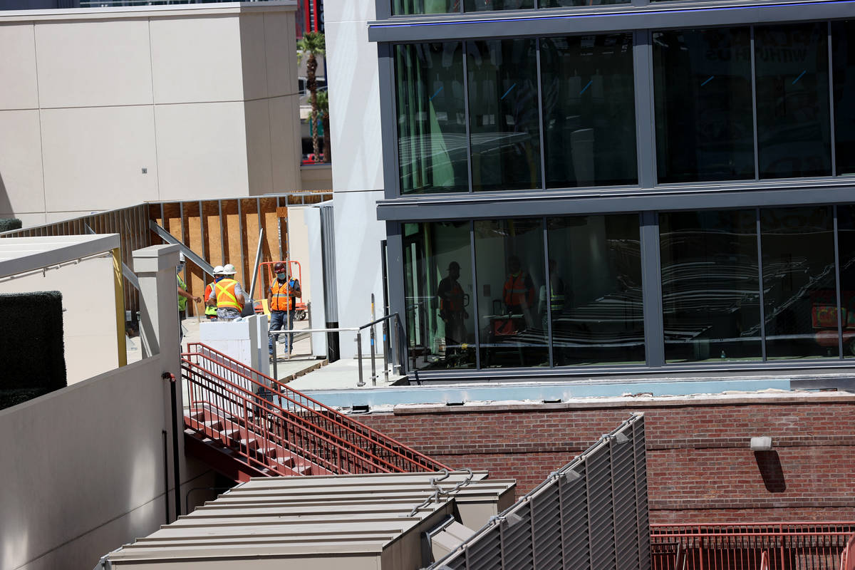 Construction workers at the Gallery Tower expansion, right, at the Downtown Grand in Las Vegas ...