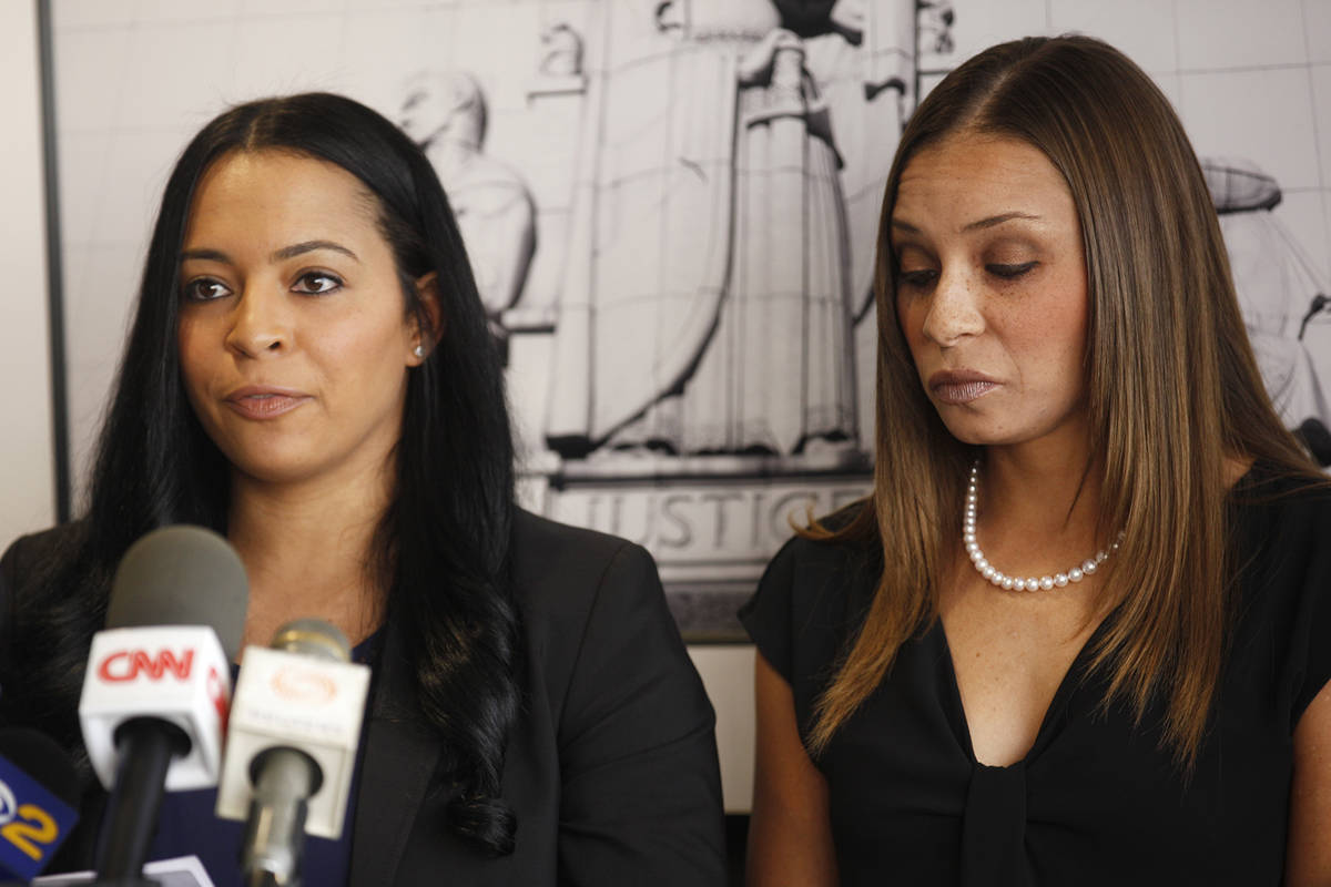 Tasha Schwikert, left, addresses the media next to her sister Jordan Schwikert at the offices o ...