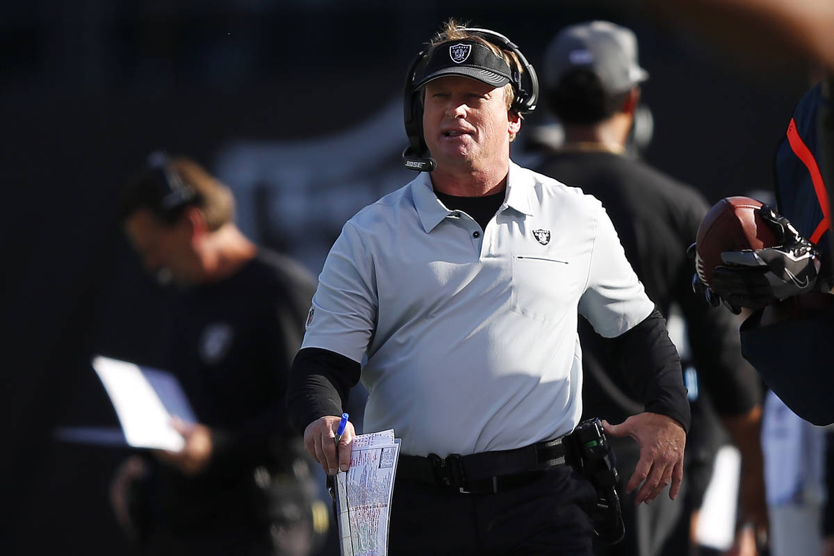 Oakland Raiders head coach Jon Gruden walks on the sideline during the second half of an NFL fo ...