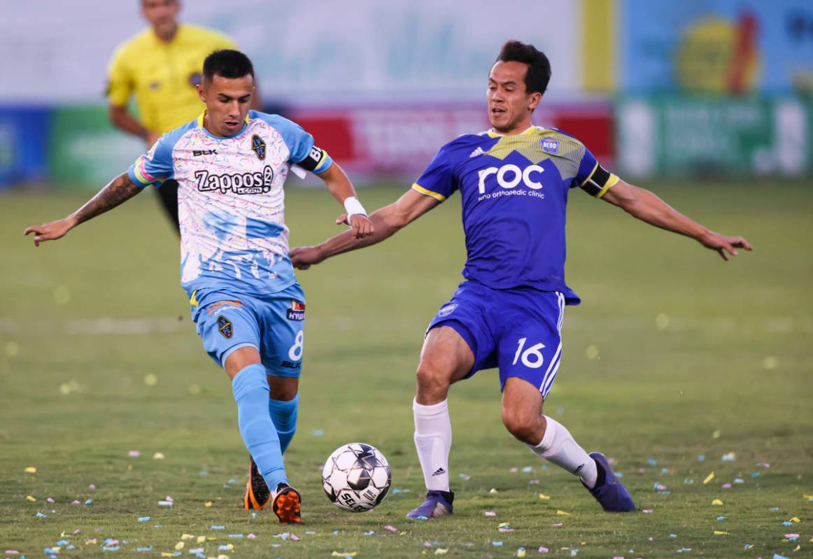 Las Vegas Lights FC's Jose Carrera battles for the ball against Reno 1868 FC's Brent Richards ( ...