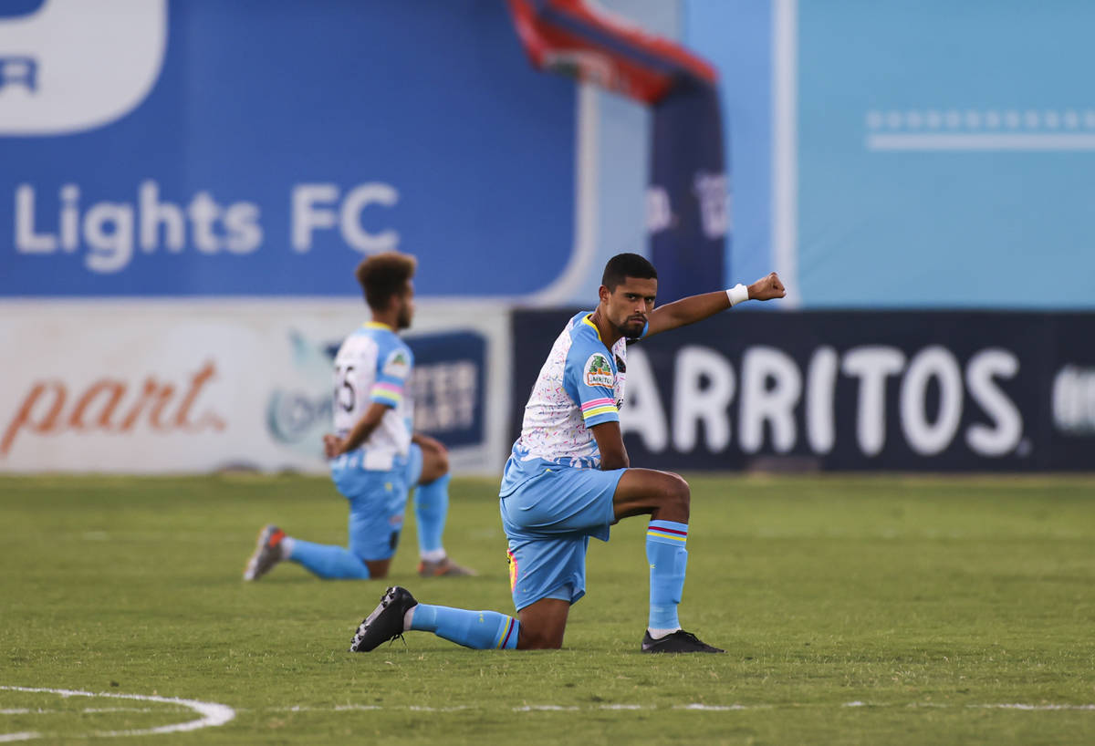 Las Vegas Lights FC's Javan Torre raises his fist as the national anthem is played before the s ...