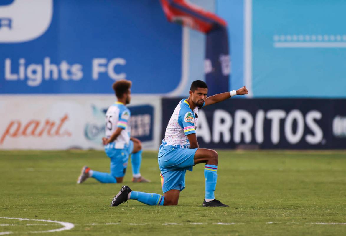 Las Vegas Lights FC's Javan Torre raises his fist as the national anthem is played before the s ...