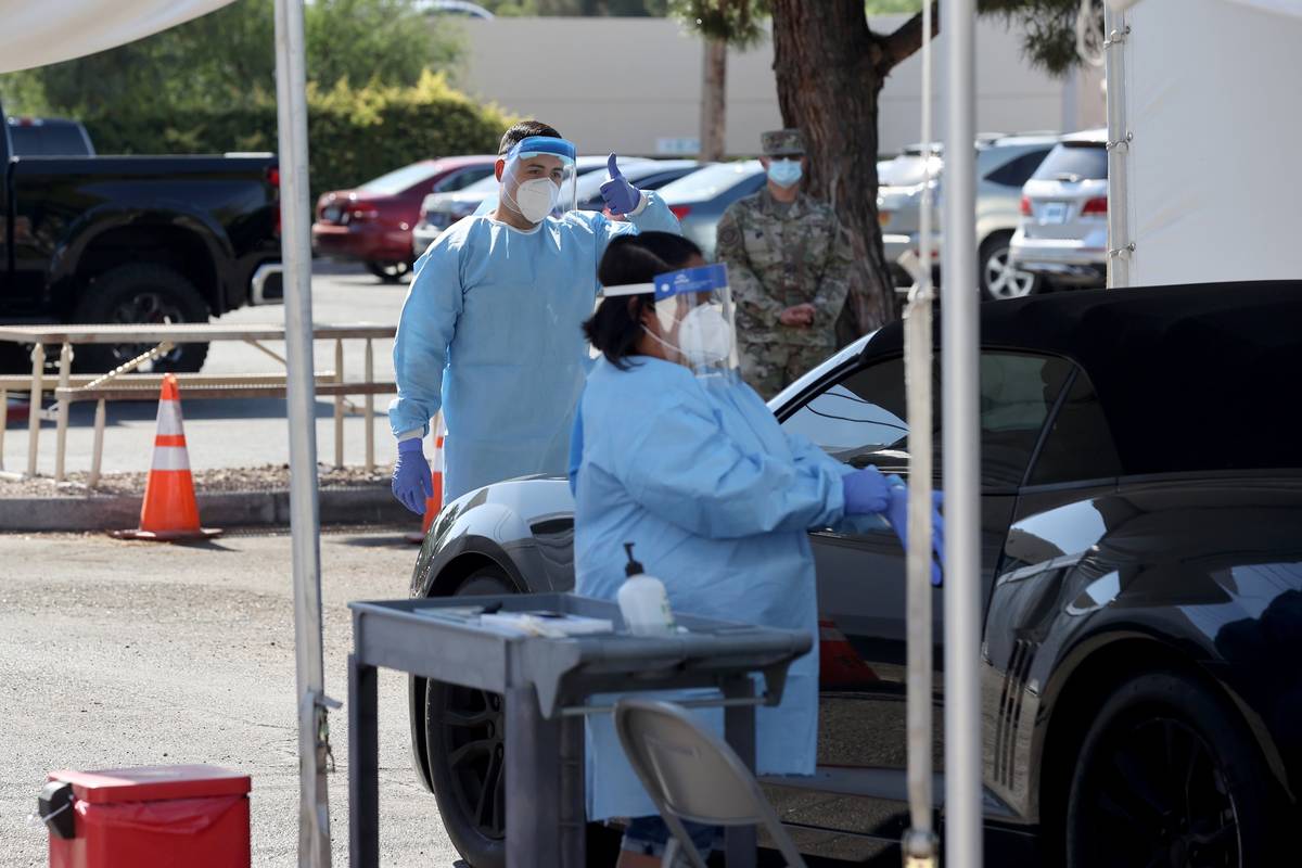 UNLV Medicine certified medical assistants and Nevada National Guard members test curbside for ...