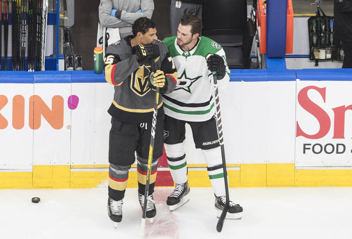 Dallas Stars' Tyler Seguin (91) and Vegas Golden Knights' Ryan Reaves (75) chat during warm ups ...