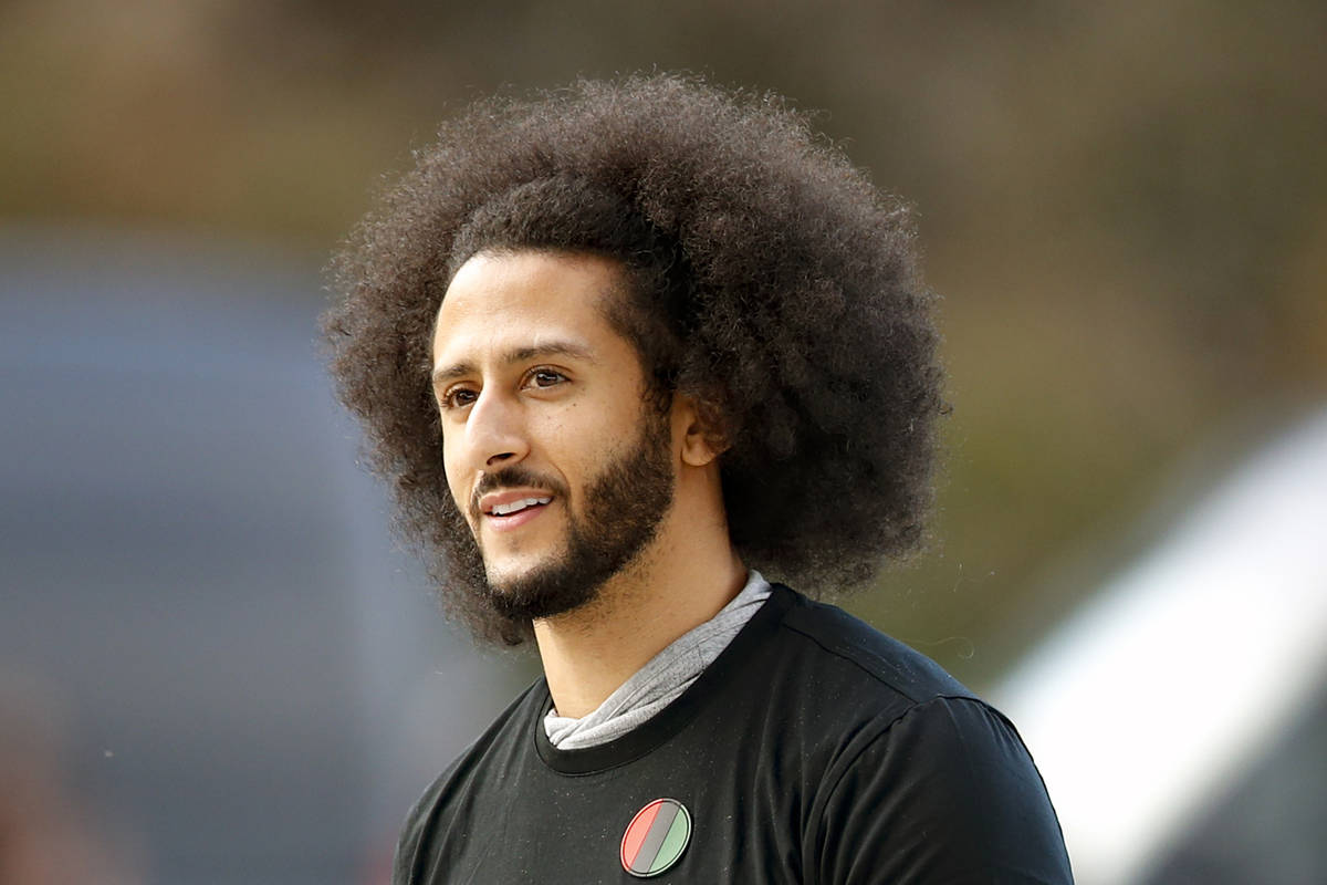 FILE - In this Nov. 16, 2019, file photo, free agent quarterback Colin Kaepernick arrives for a ...