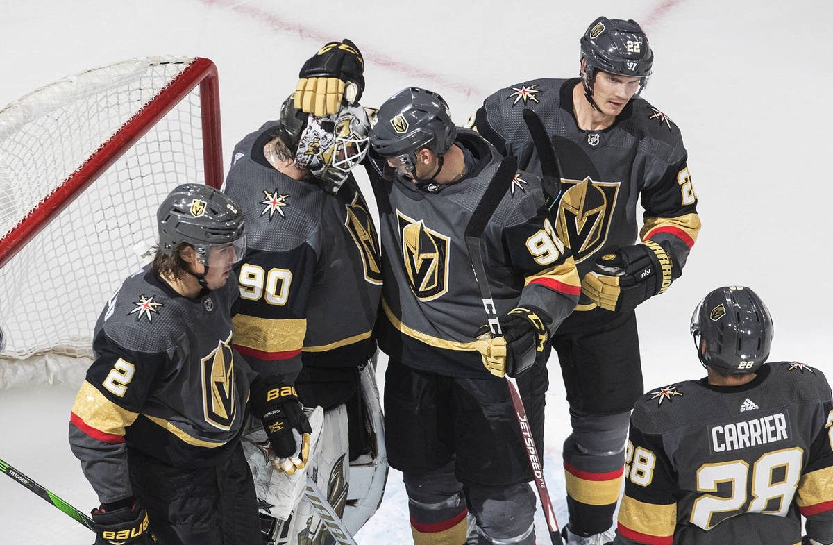 Vegas Golden Knights celebrate a win over the Dallas Stars in an NHL hockey playoff game Monday ...