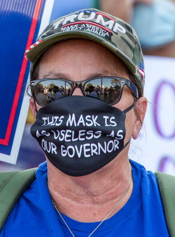 One on many protestors gathered at the Grant Sawyer building to voice opposition against AB4, a ...