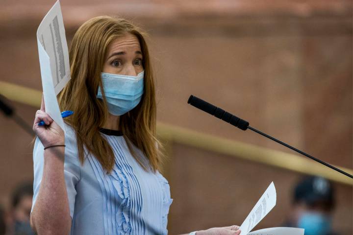 Owner Kristen Corral of Tacotarian restaurant holds up letters from fellow restaurant owners wh ...