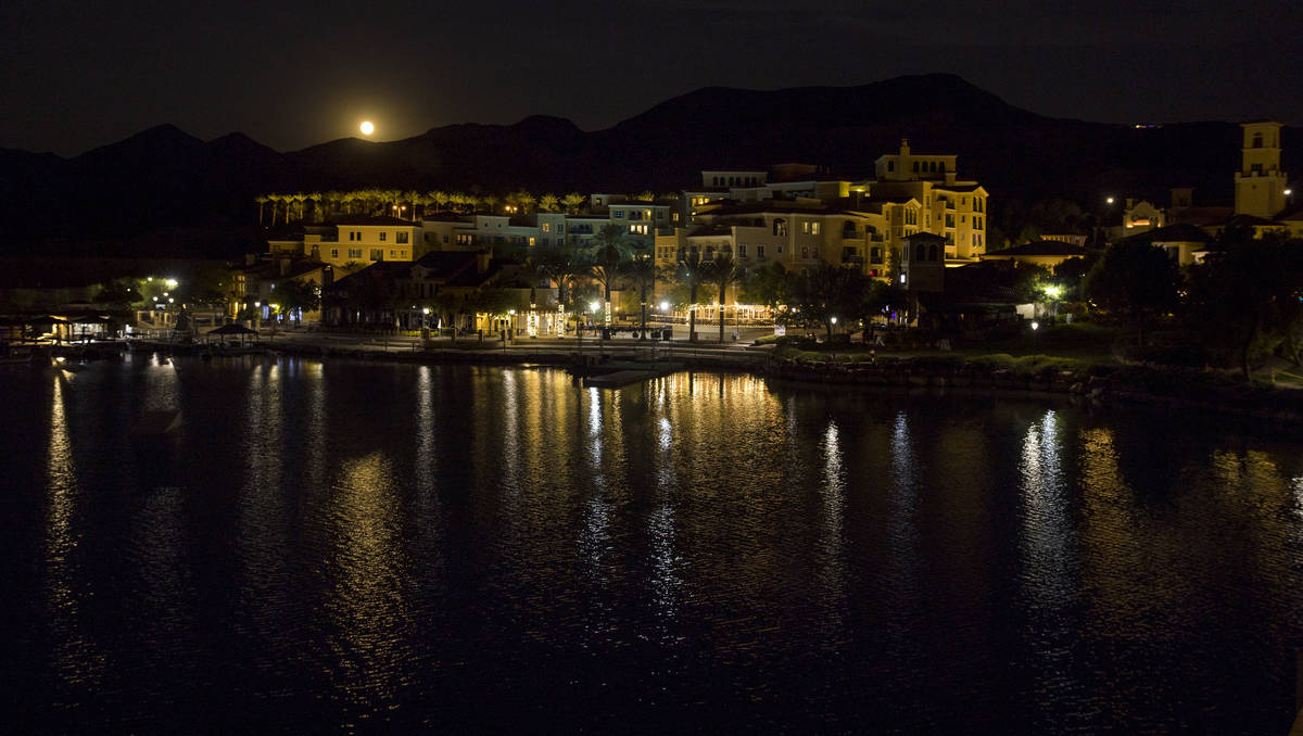 The Sturgeon moon rises above the shops at Lake Las Vegas on Monday, August 3, 2020, in Henders ...