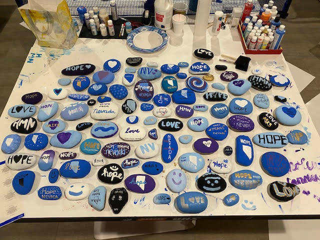 The teens painted over 100 rocks, equating about 300 lbs of rocks, with positive messages of lo ...