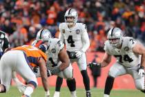 Oakland Raiders quarterback Derek Carr (4) sets up behind his offensive linemen Rodney Hudson ( ...