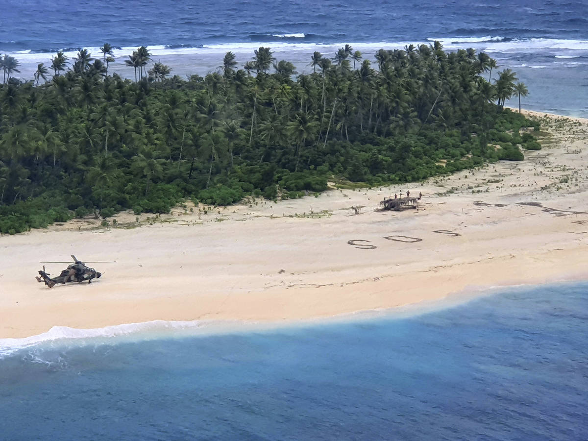 In this photo provided by the Australian Defence Force, an Australian Army helicopter lands on ...
