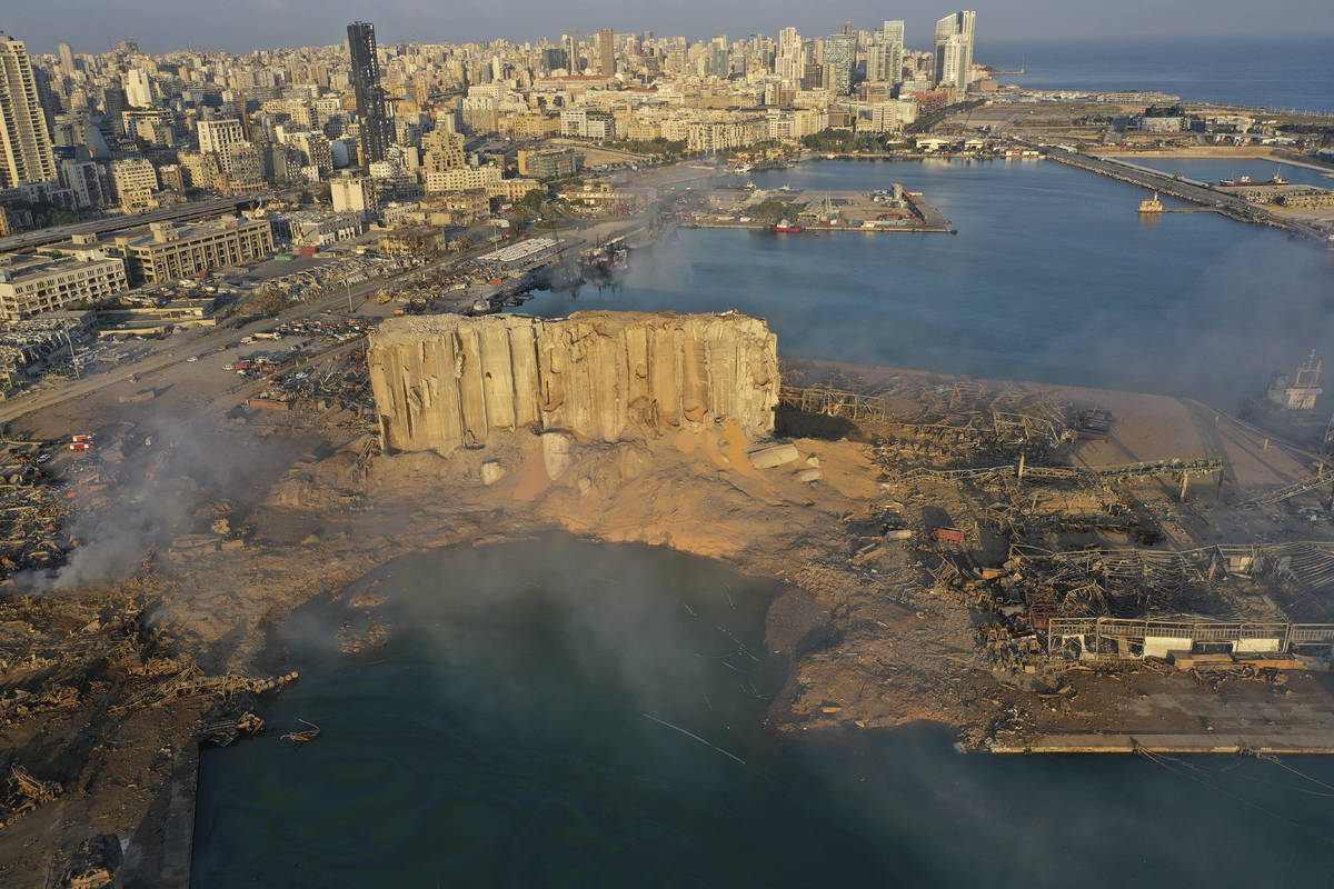 A drone picture shows the scene of an explosion that hit the seaport of Beirut, Lebanon, Wednes ...