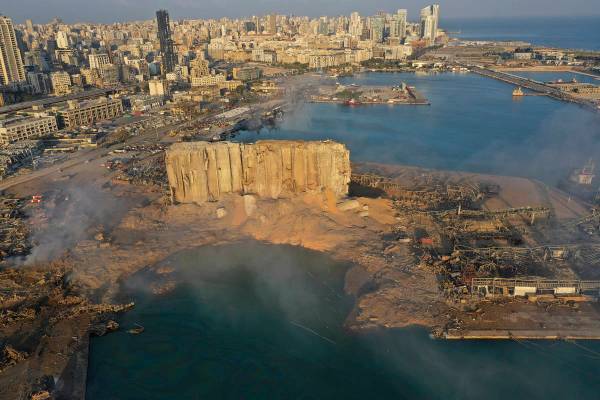 A drone picture shows the scene of an explosion that hit the seaport of Beirut, Lebanon, Wednes ...