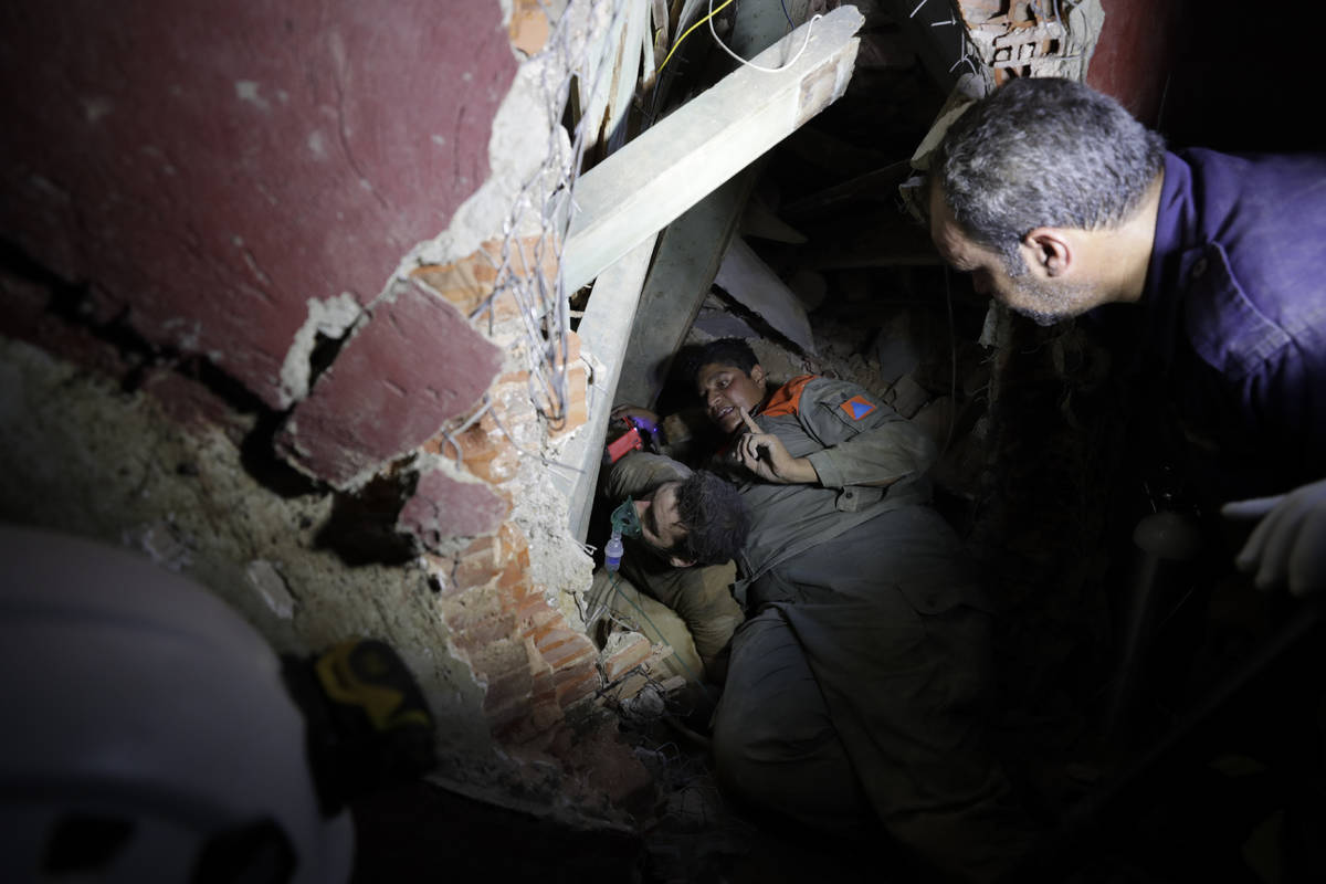 Lebanese soldiers search for survivors after a massive explosion in Beirut, Lebanon, Wednesday, ...