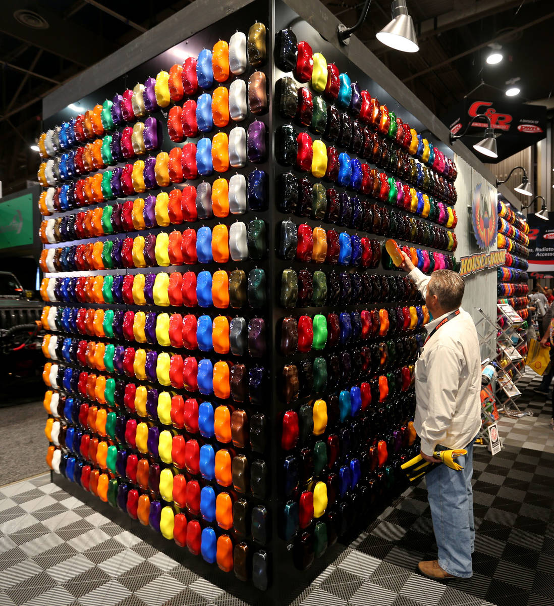 Gary Grubb of Fairfield, Ohio, looks for a color for his car at the House of Kolor booth at the ...