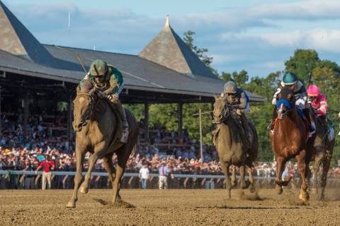 In this Aug. 24, 2019, file photo, Code of Honor, left, with jockey John Velazquez, leads the f ...