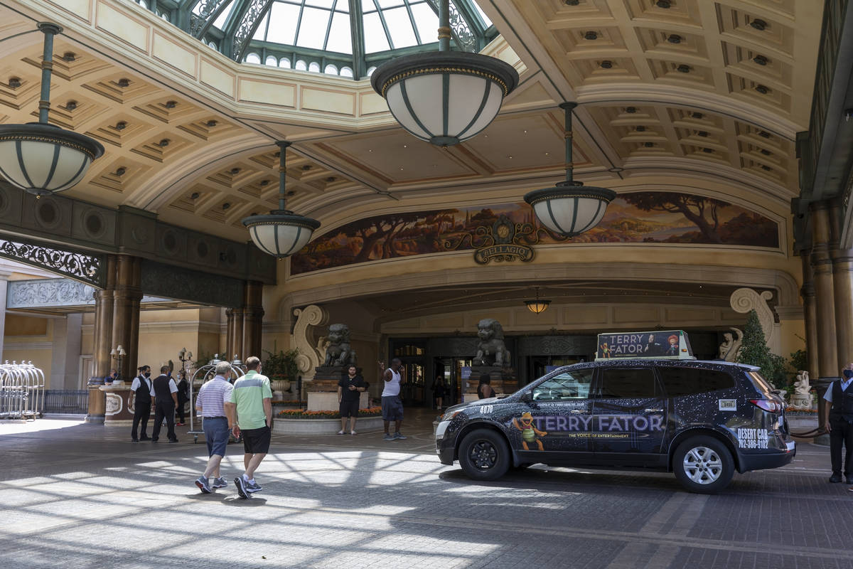 Guests walk to the Bellagio on the Strip, Thursday, Aug. 6, 2020, in Las Vegas. (Elizabeth Brum ...
