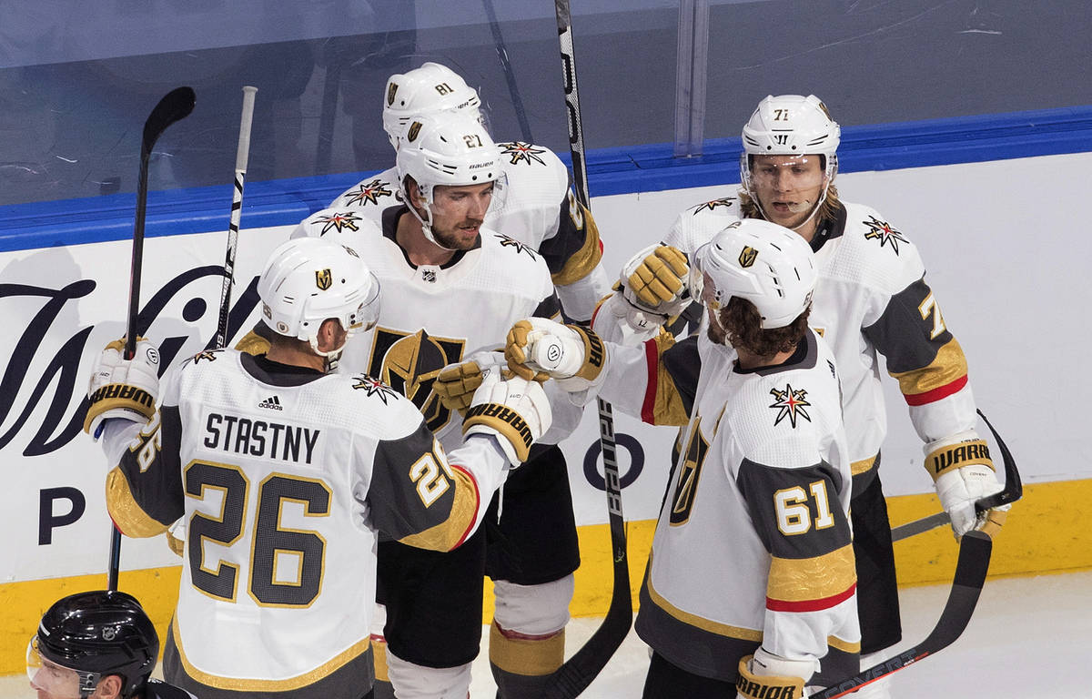 Vegas Golden Knights celebrate a goal during the second period of an NHL hockey playoff game ag ...