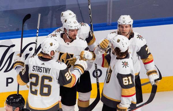 Vegas Golden Knights celebrate a goal during the second period of an NHL hockey playoff game ag ...