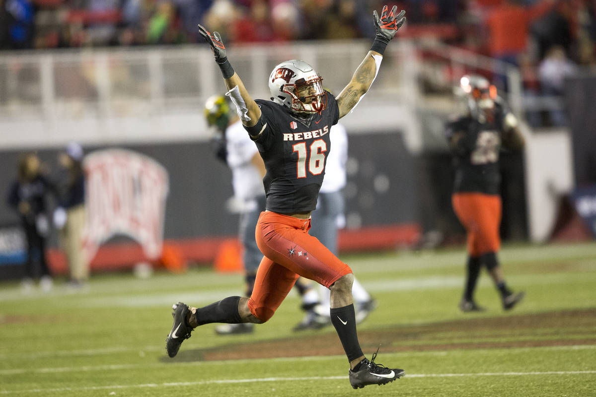 UNLV Rebels linebacker Javin White (16) celebrates his interceptions against the Nevada Wolf Pa ...