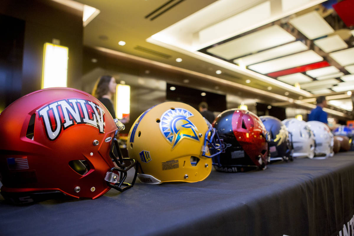 Helmets representing teams in the Mountain West devision at the Mountain West Football Media Su ...