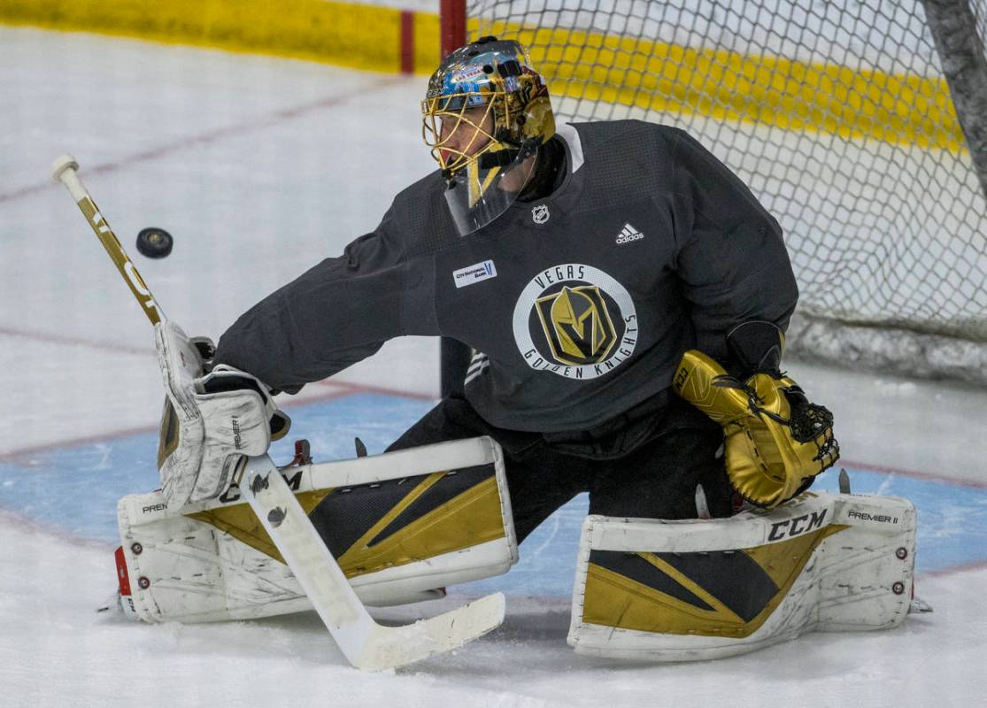 Vegas Golden Knights goaltender Marc-Andre Fleury (29) deflects a shot away from the net during ...