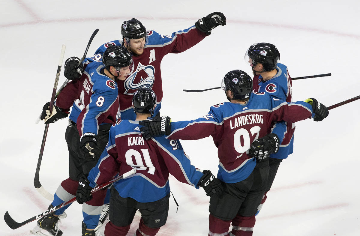 Colorado Avalanche players celebrate a goal during second period NHL hockey Stanley Cup qualify ...