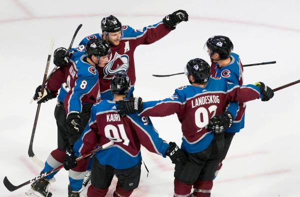Colorado Avalanche players celebrate a goal during second period NHL hockey Stanley Cup qualify ...