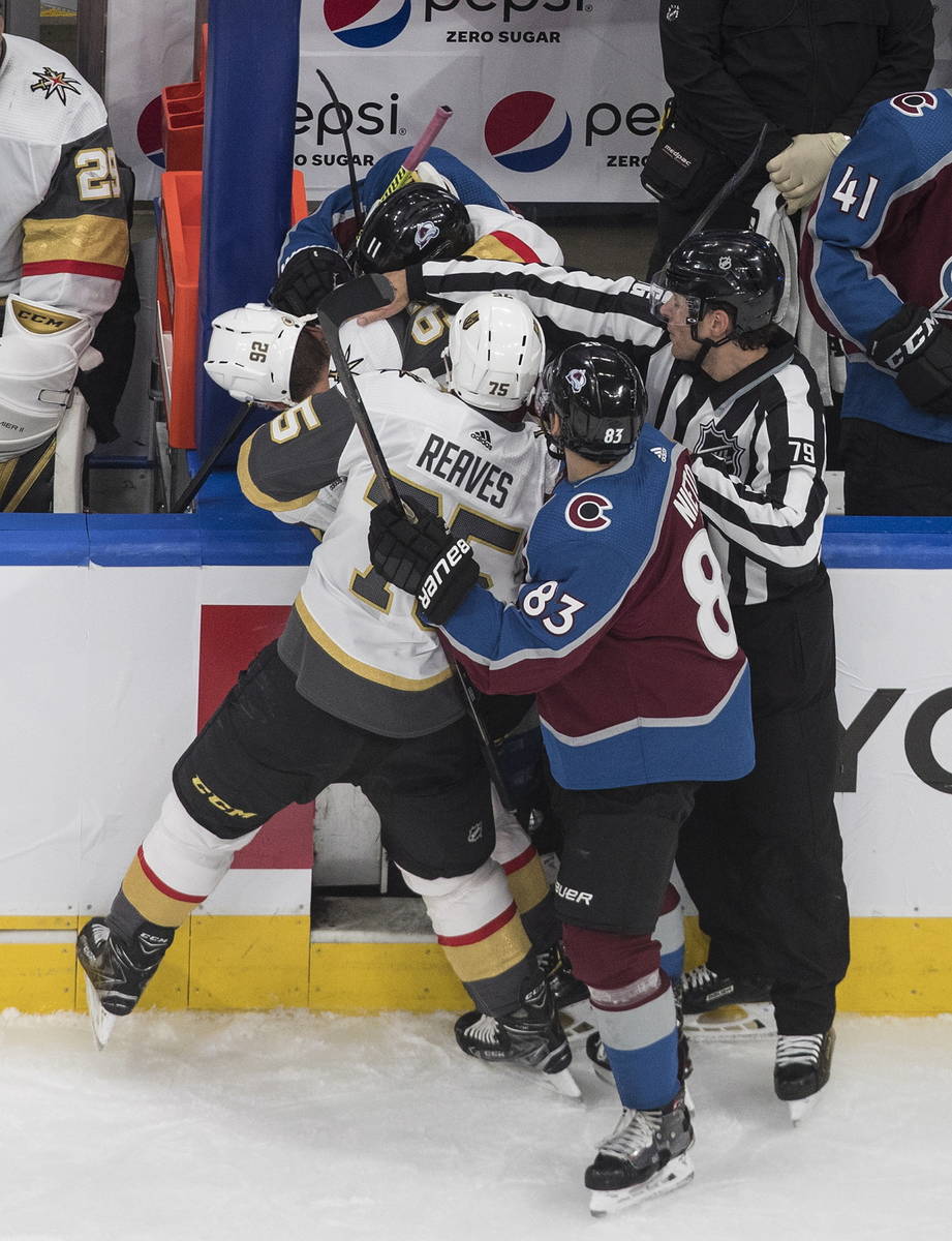 Colorado Avalanche and the Vegas Golden Knights players mix it up during the third period of an ...