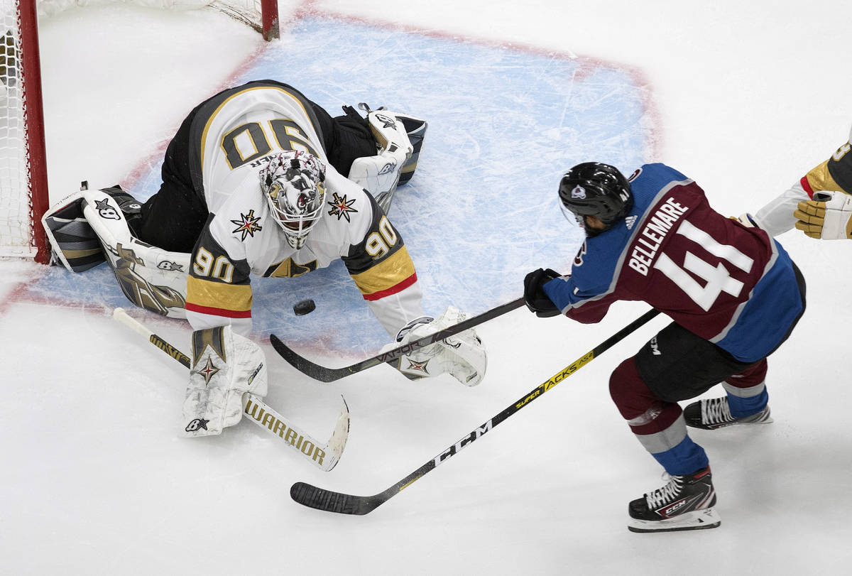 Colorado Avalanche's Pierre-Edouard Bellemare (41) is stopped by Vegas Golden Knights goalie Ro ...