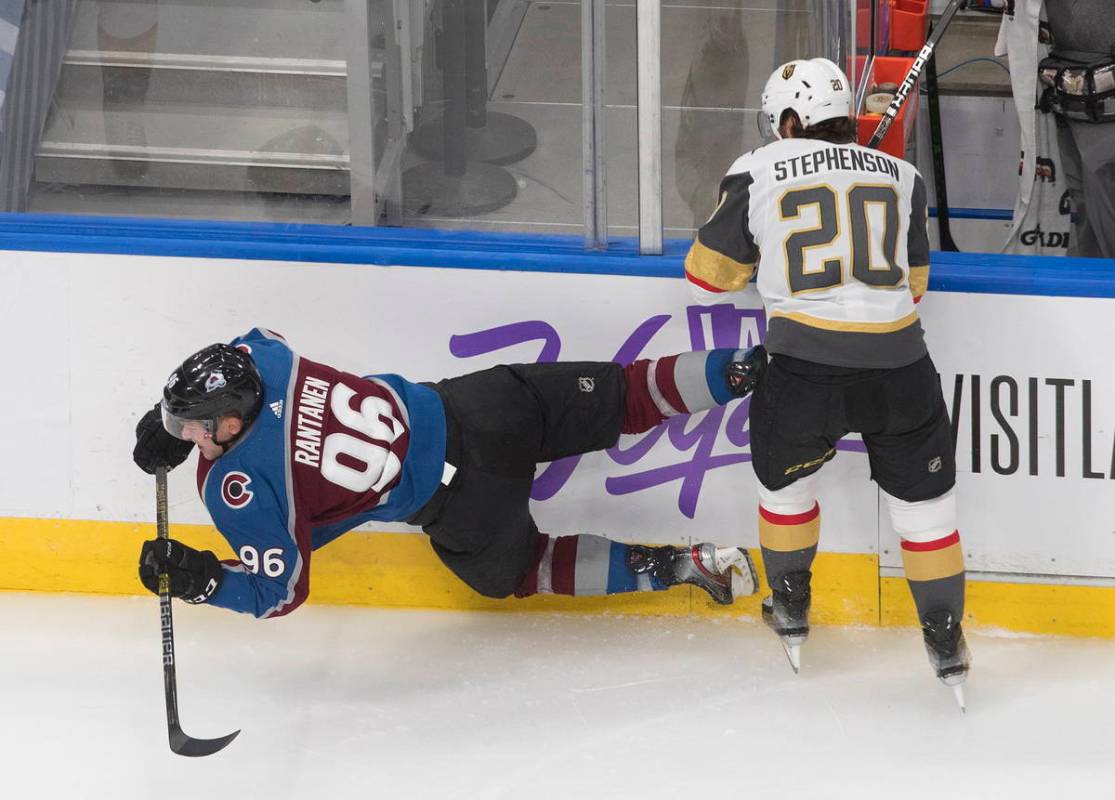 Colorado Avalanche's Mikko Rantanen (96) is checked by Vegas Golden Knights' Chandler Stephenso ...