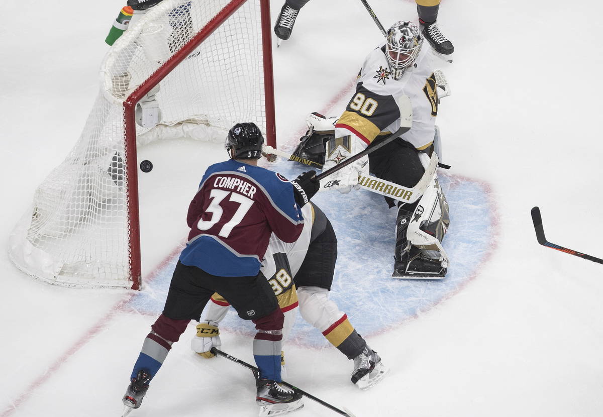 Colorado Avalanche's J.T. Compher (37) watches the puck go in past Vegas Golden Knights goalie ...