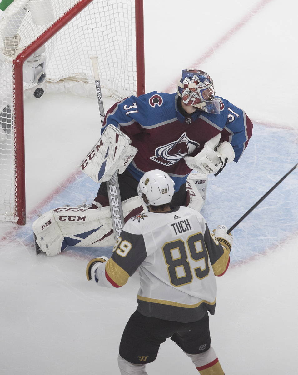 Colorado Avalanche goalie Philipp Grubauer (31) gives up a goal to Vegas Golden Knights' Alex T ...