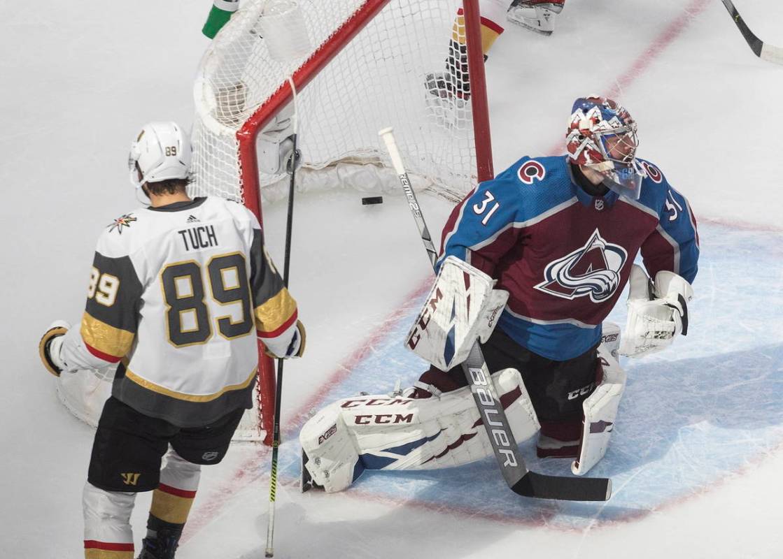 Colorado Avalanche goalie Philipp Grubauer (31) gives up a goal to Vegas Golden Knights' Alex T ...