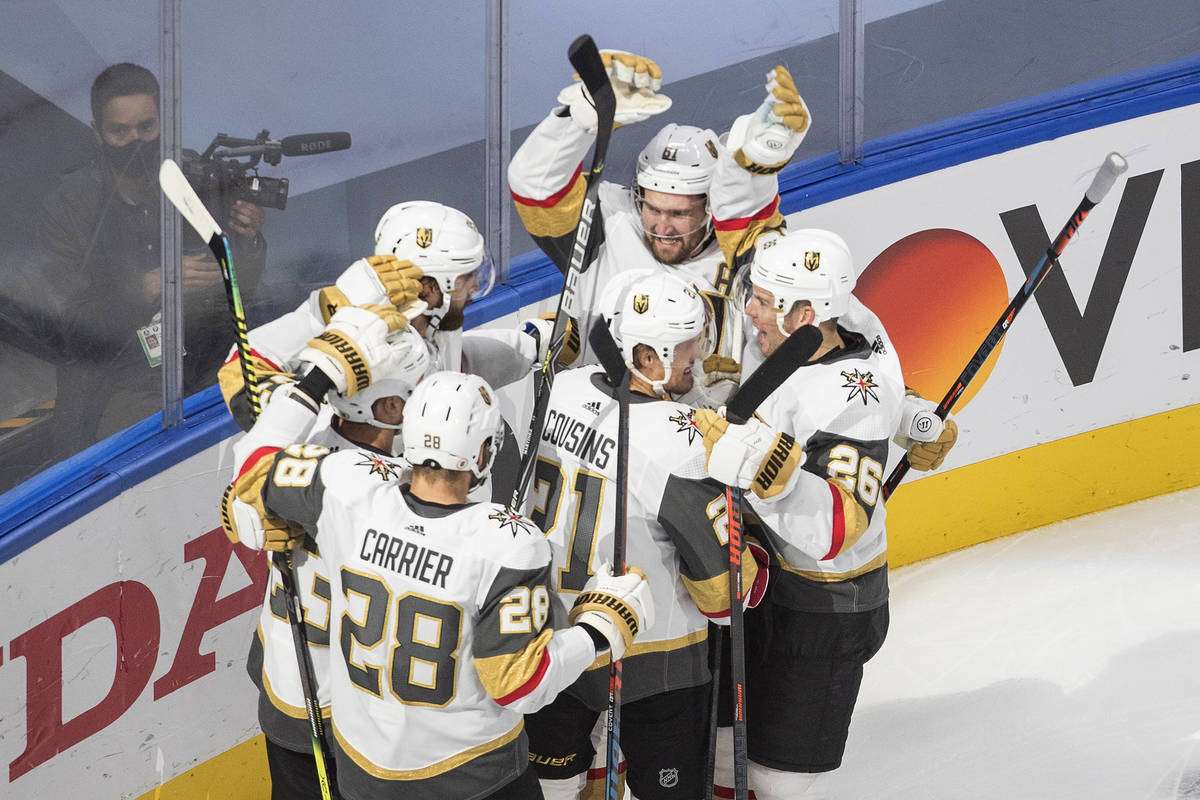 Vegas Golden Knights celebrate the team's overtime win over the Colorado Avalanche in an NHL ho ...