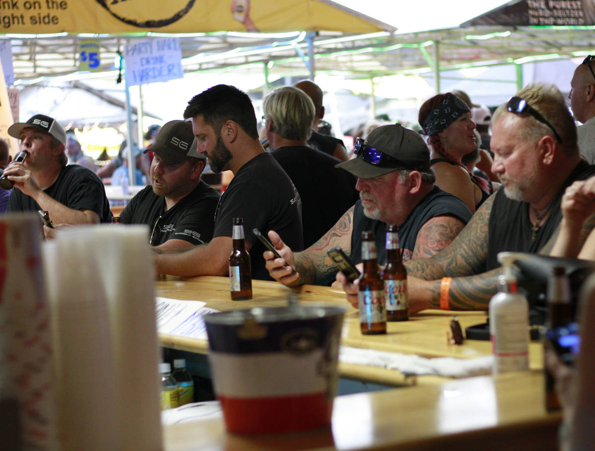 People crowded around bars in Sturgis, S.D., on Friday, Aug. 7, 2020 during the 80th anniversar ...
