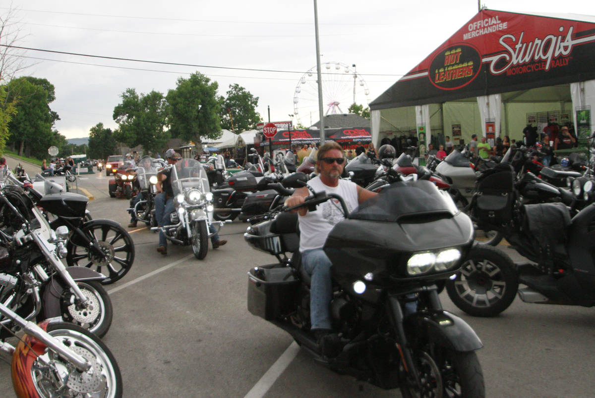 Bikers ride through downtown Sturgis, S.D., on Friday, Aug. 7, 2020. Organizers of the Sturgis ...