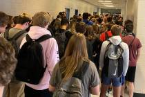 Students crowd a hallway, Tuesday, Aug. 4, 2020, at North Paulding High School in Dallas, Ga. ...