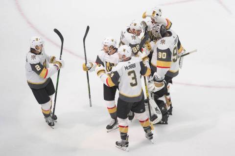 Vegas Golden Knights celebrate an overtime win over the Colorado Avalanche in an NHL hockey pla ...
