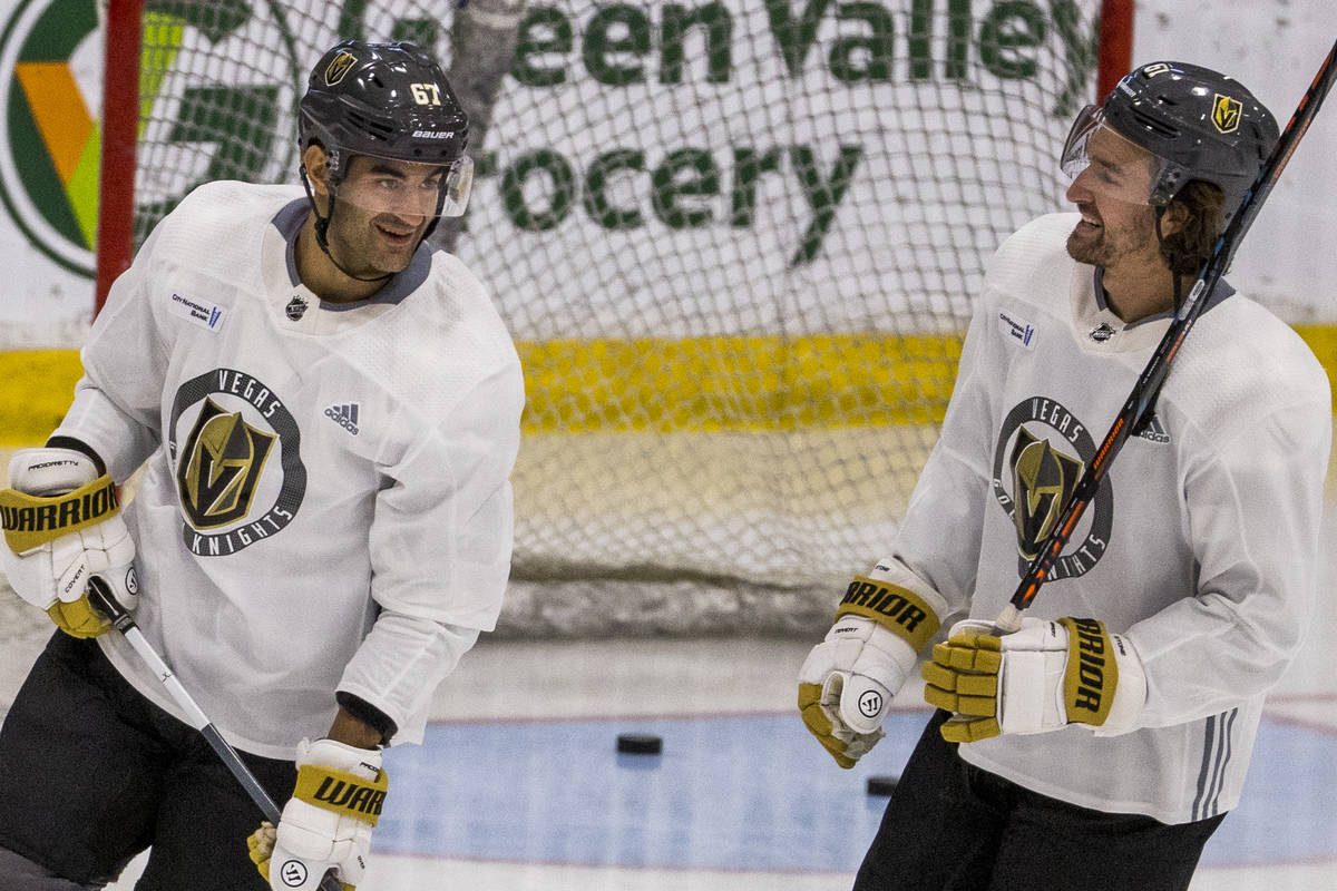 Vegas Golden Knights left wing Max Pacioretty (67, left) talks with right wing Mark Stone (61) ...