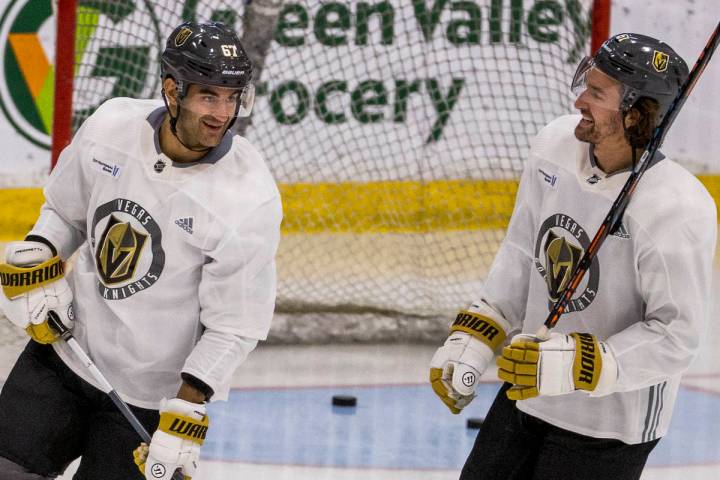 Vegas Golden Knights left wing Max Pacioretty (67, left) talks with right wing Mark Stone (61) ...