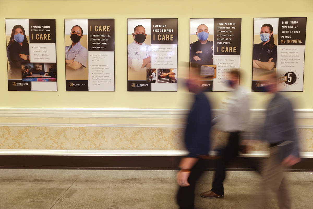 Posters in an employee area at the Bellagio in Las Vegas Tuesday, Aug. 4, 2020. The posters are ...