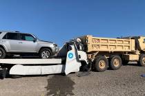 The driver of a white Isuzu tow truck carrying a silver SUV was killed Monday, Aug. 10, 2020, a ...