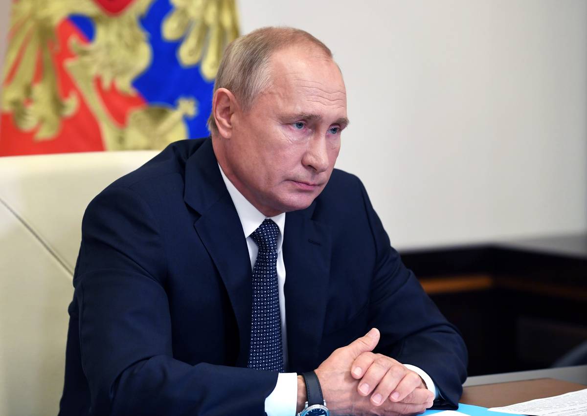 Russian President Vladimir Putin attends a cabinet meeting at the Novo-Ogaryovo residence outsi ...