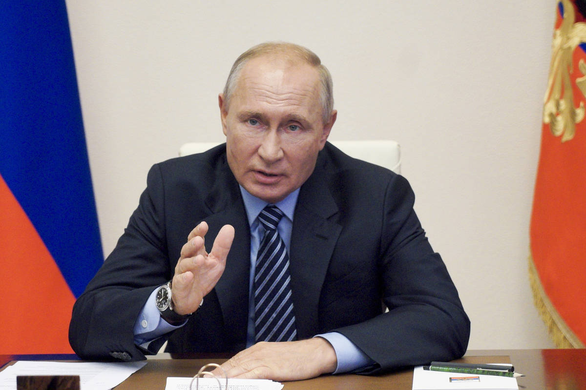 In a file photo taken on Thursday, July 9, 2020, Russian President Vladimir Putin gestures duri ...