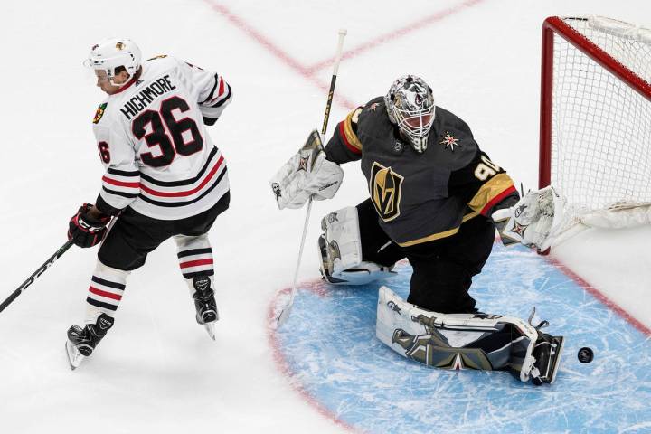 Chicago Blackhawks' Matthew Highmore (36) tries to screen as Vegas Golden Knights goalie Robin ...