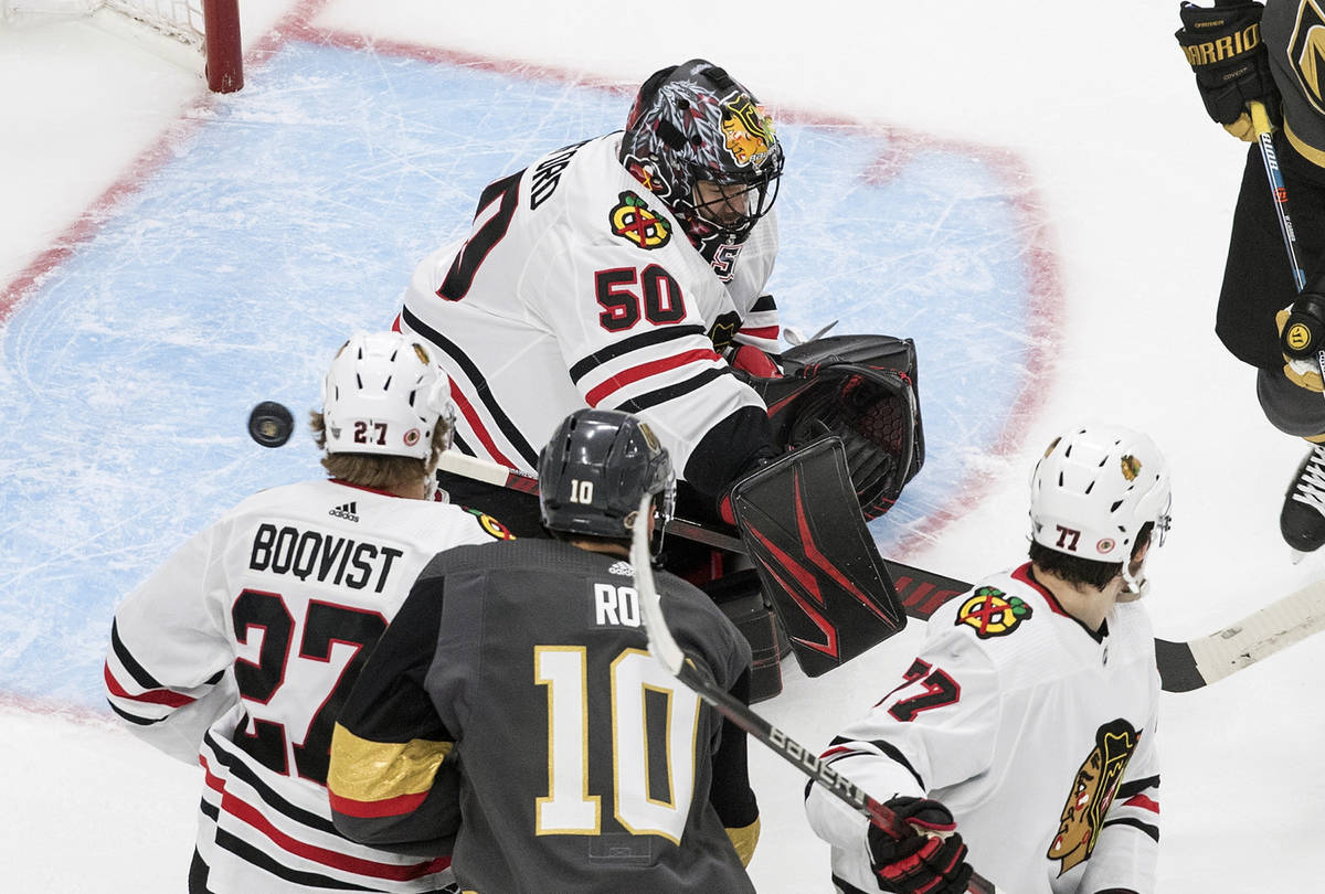 Chicago Blackhawks goalie Corey Crawford (50) makes a save against the Vegas Golden Knights dur ...